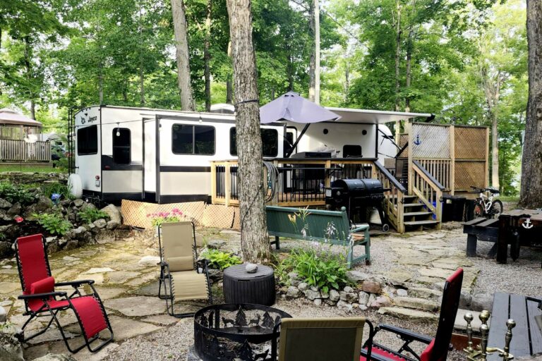 private wooded site with trailer